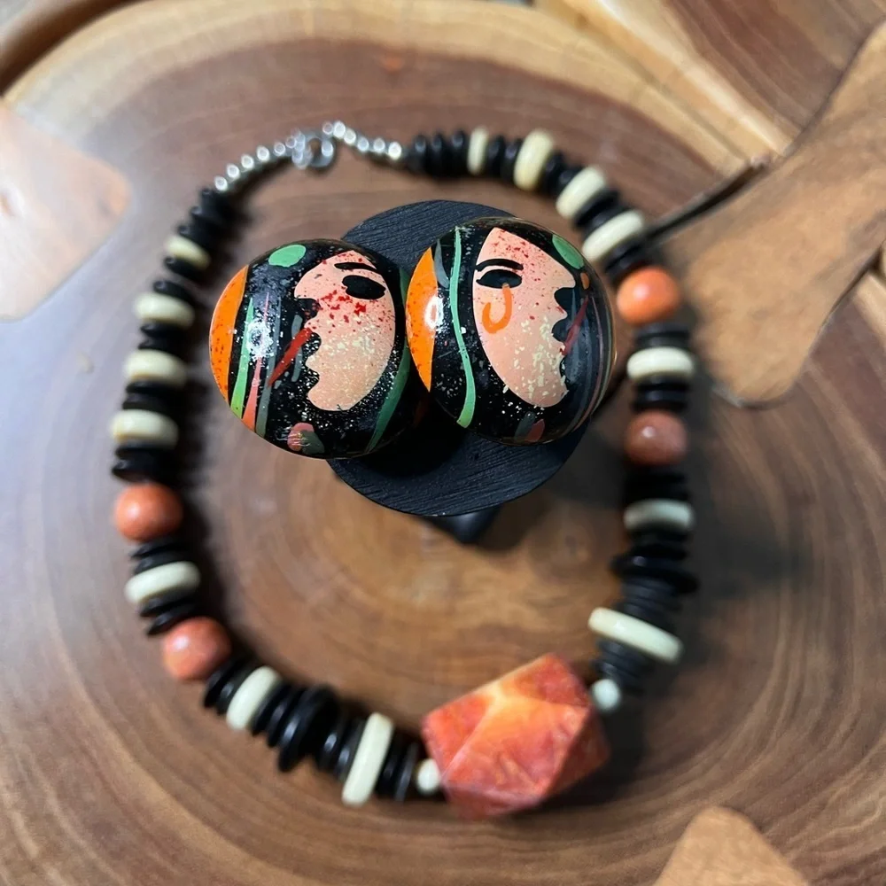 Three piece, rust and black stone and beaded costume jewelry.